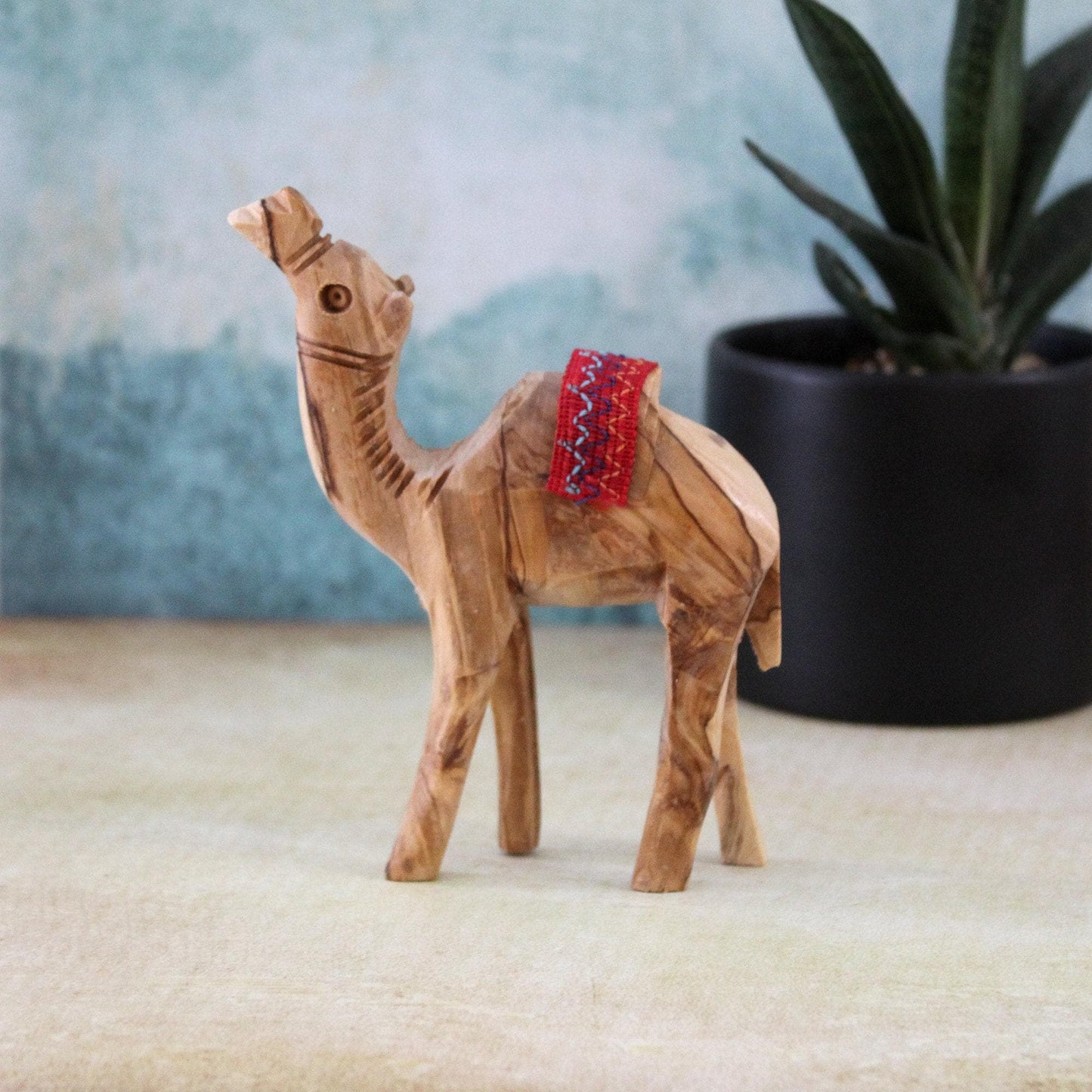 5.5" Olive Wood Camel Statue Hand Carved in the Holy Land Figurine Red Saddle. Handmade in the Holy Land, Jerusalem
