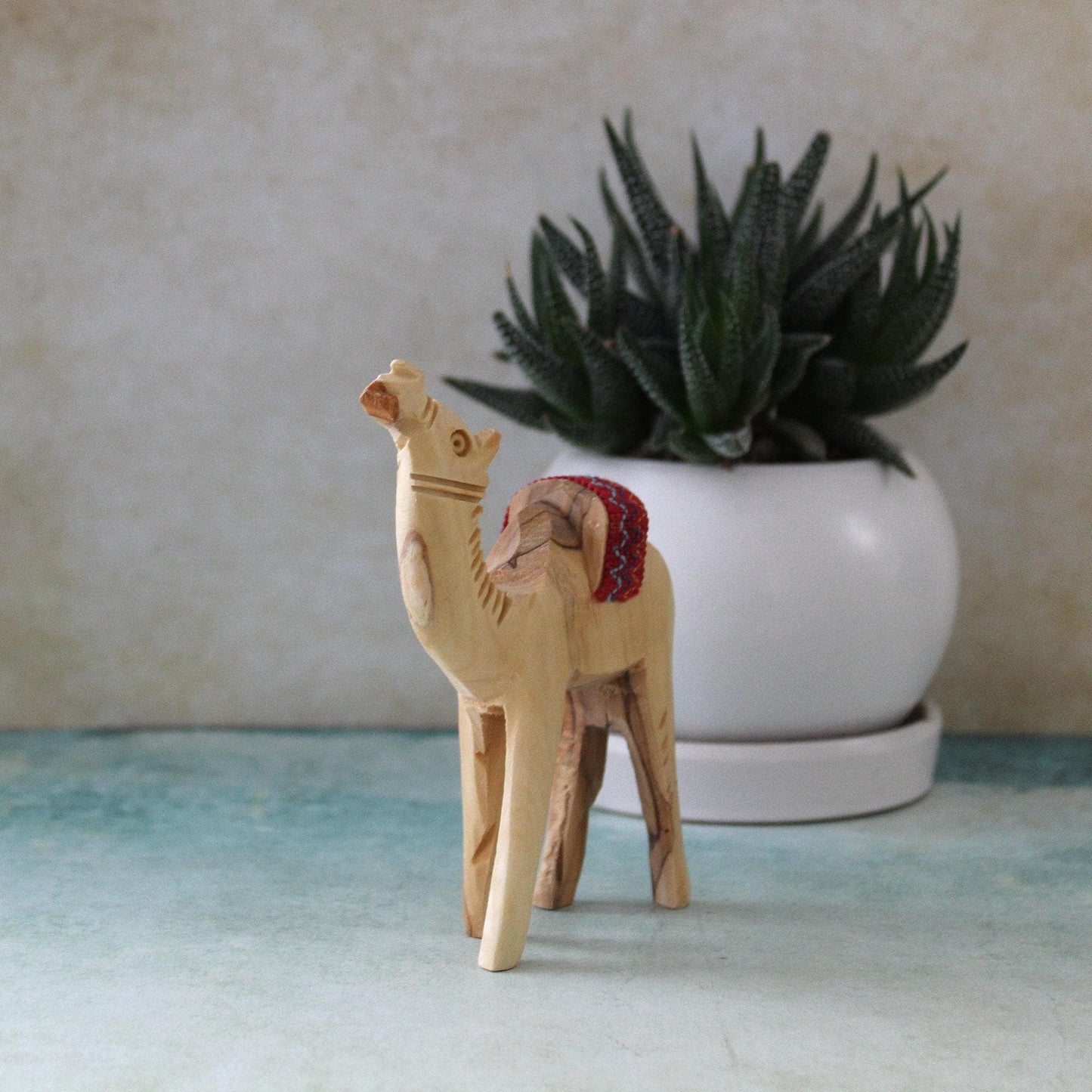 5.5" Olive Wood Camel Statue Hand Carved in the Holy Land Figurine Red Saddle. Handmade in the Holy Land, Jerusalem