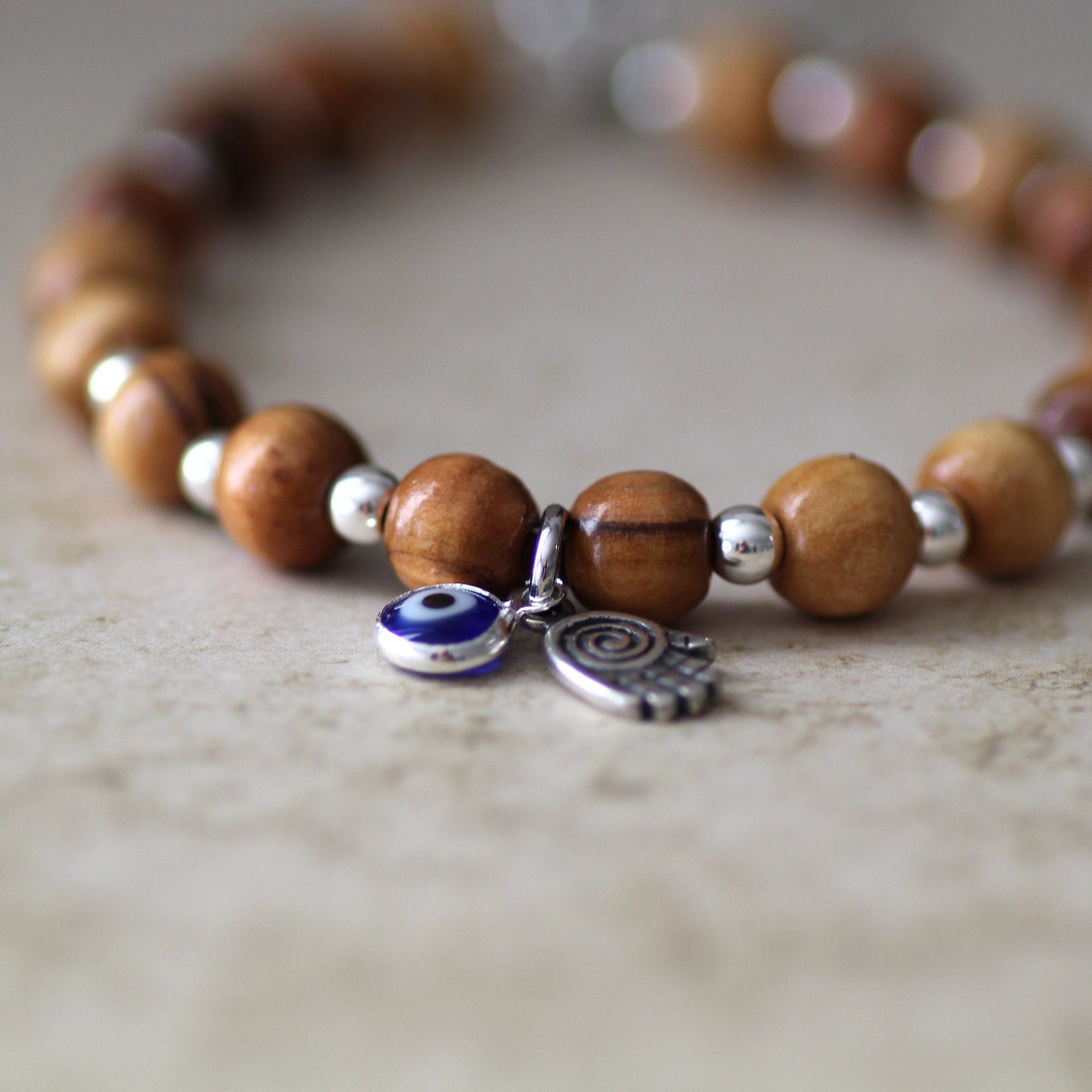 Sacred Sentinel: Artisan Evil Eye and Hamsa Hand Bracelet, a Symbolic Shield of Protection and Trendy Talisman Against Negativity