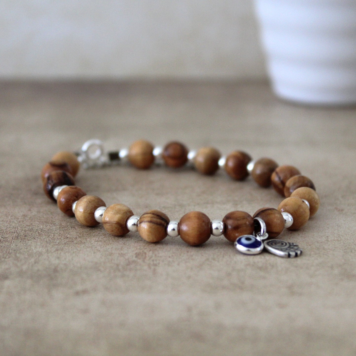 Sacred Sentinel: Artisan Evil Eye and Hamsa Hand Bracelet, a Symbolic Shield of Protection and Trendy Talisman Against Negativity