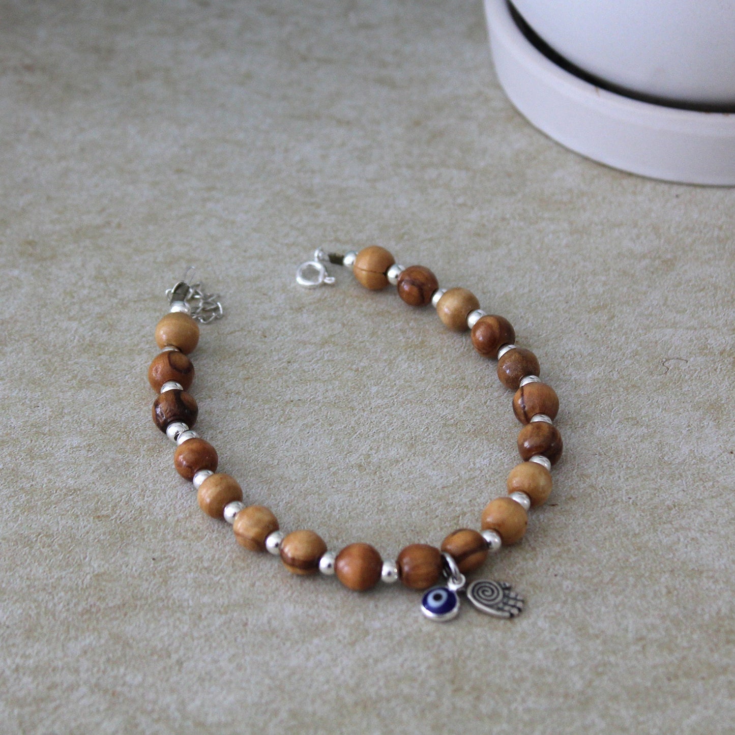 Sacred Sentinel: Artisan Evil Eye and Hamsa Hand Bracelet, a Symbolic Shield of Protection and Trendy Talisman Against Negativity