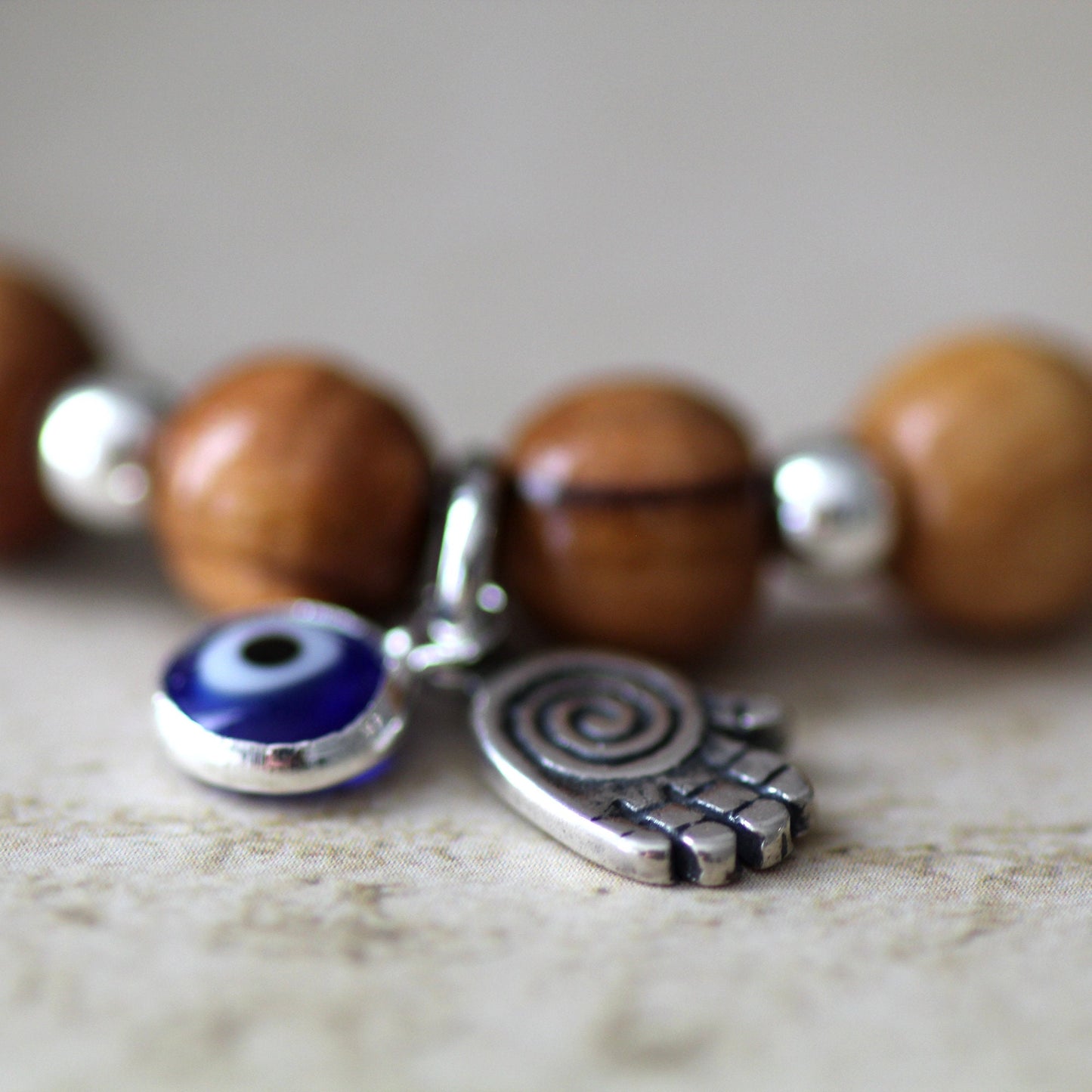 Sacred Sentinel: Artisan Evil Eye and Hamsa Hand Bracelet, a Symbolic Shield of Protection and Trendy Talisman Against Negativity