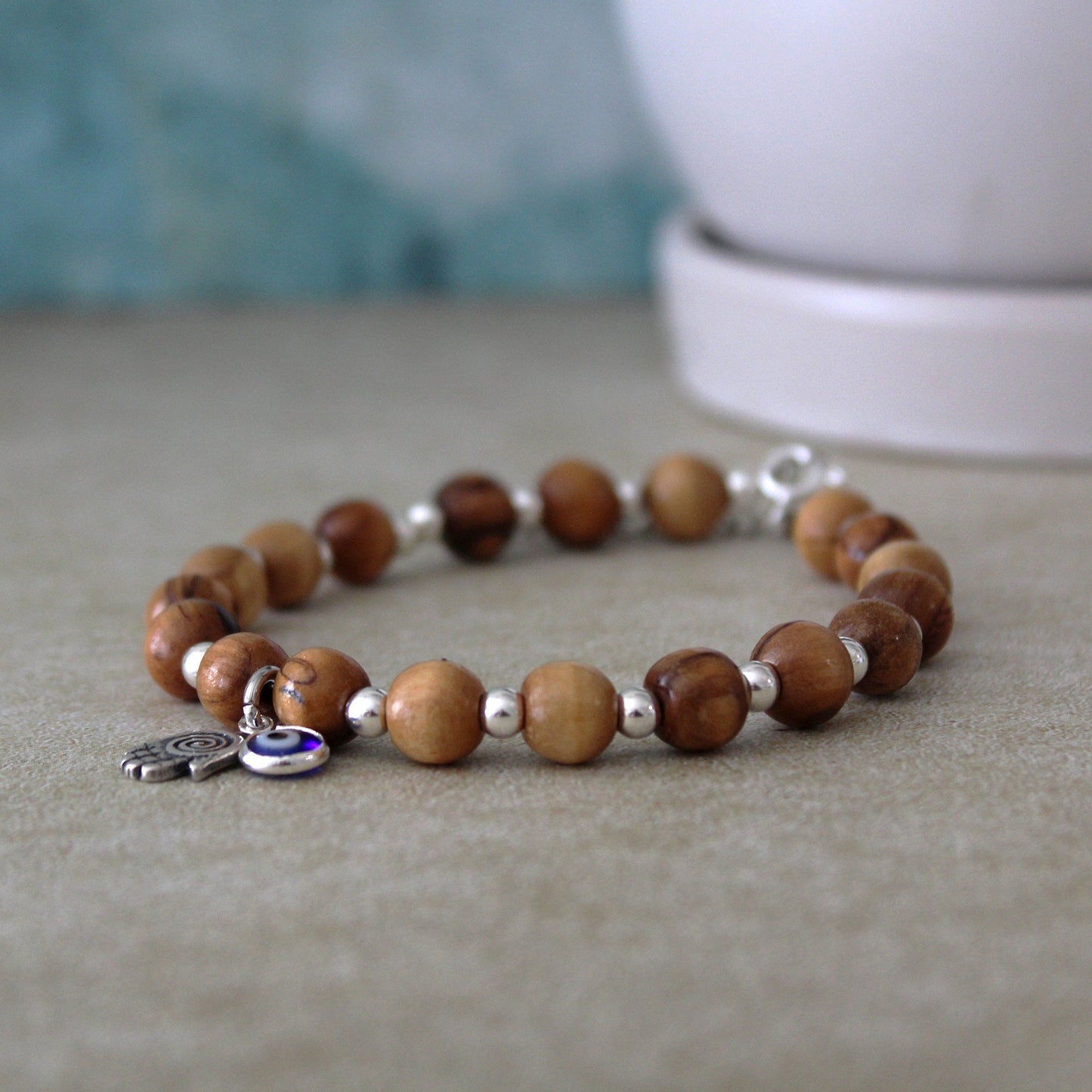 Sacred Sentinel: Artisan Evil Eye and Hamsa Hand Bracelet, a Symbolic Shield of Protection and Trendy Talisman Against Negativity