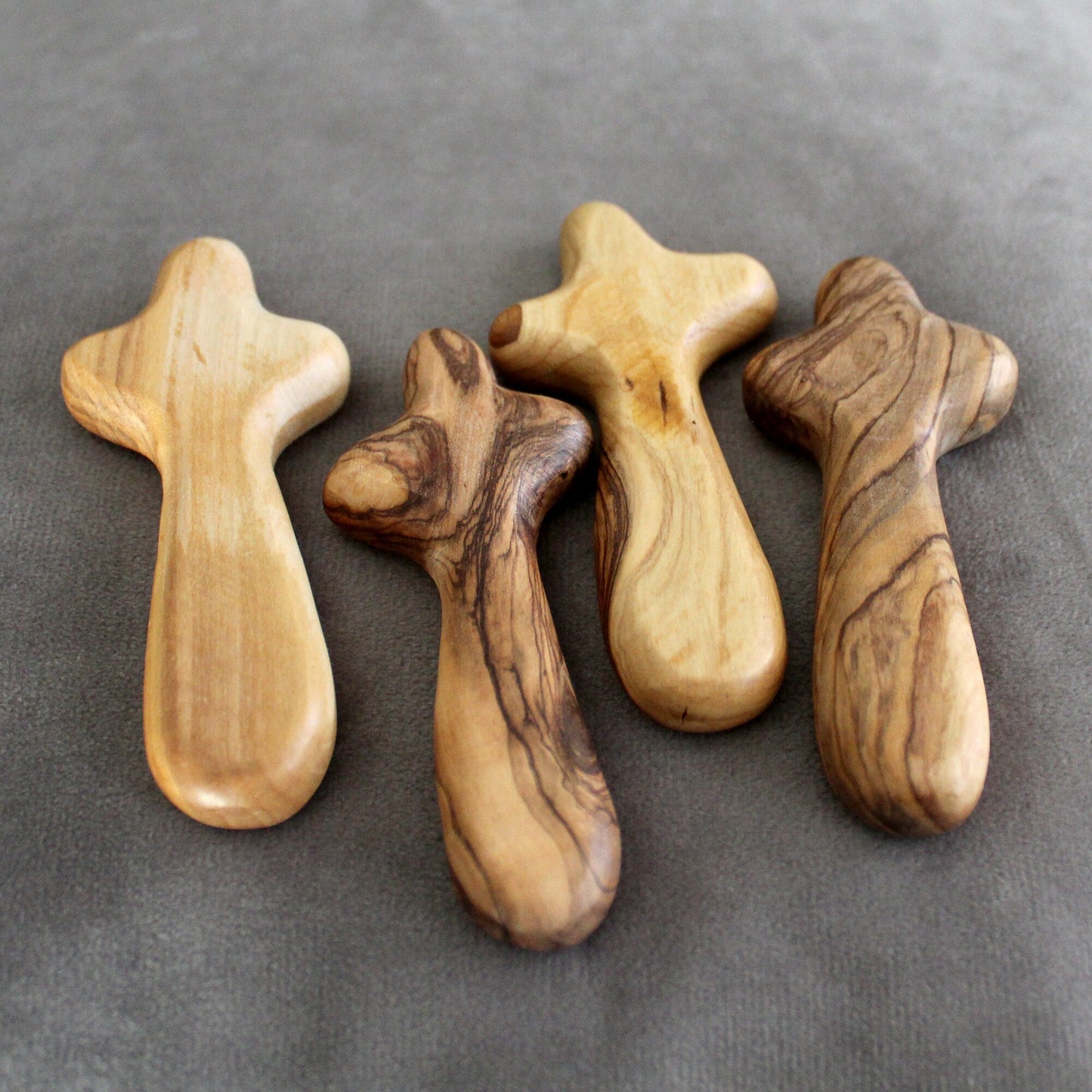 Bundle of 4 Handmade Comfort Crosses Also Called Palm Cross Made From Olive Wood in the Holy Land. Hand Carved Olive Wood Holding Crosses
