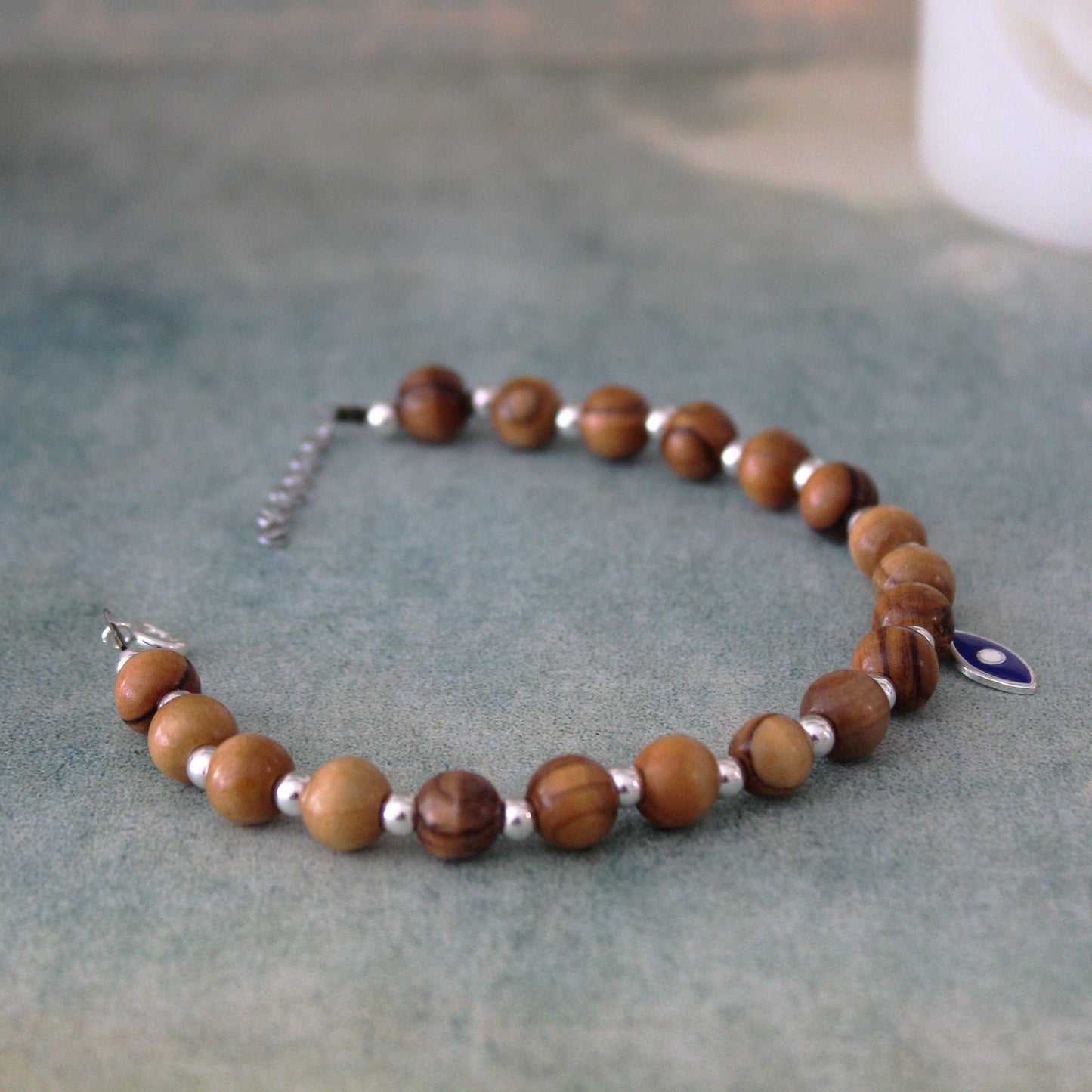 Divine Guardian: Handcrafted Lava Stone Bracelet with Enchanting Silver 925 Blue Fish Charm - A Fusion of Israeli and Christian Jewelry