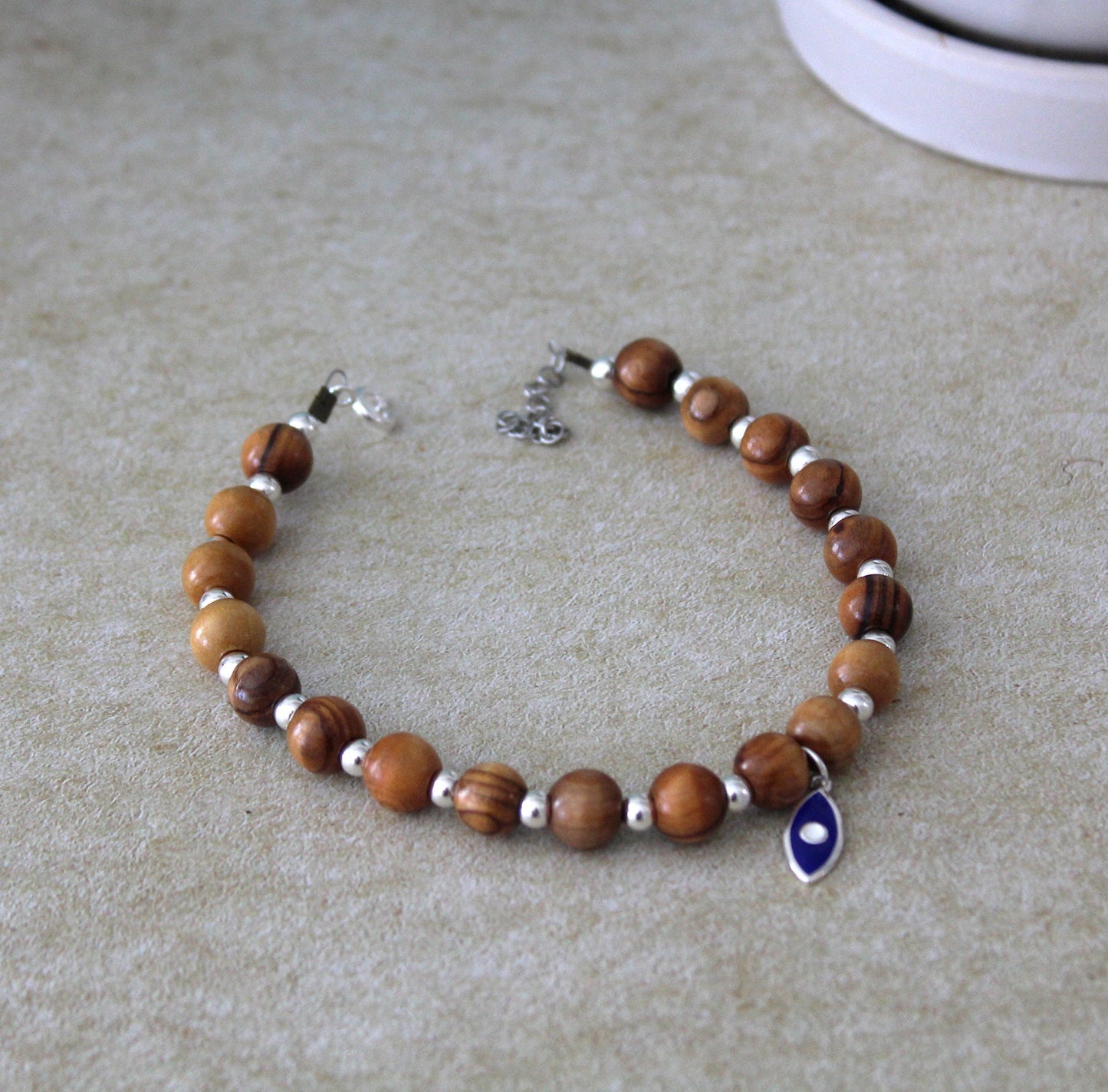 Divine Guardian: Handcrafted Lava Stone Bracelet with Enchanting Silver 925 Blue Fish Charm - A Fusion of Israeli and Christian Jewelry