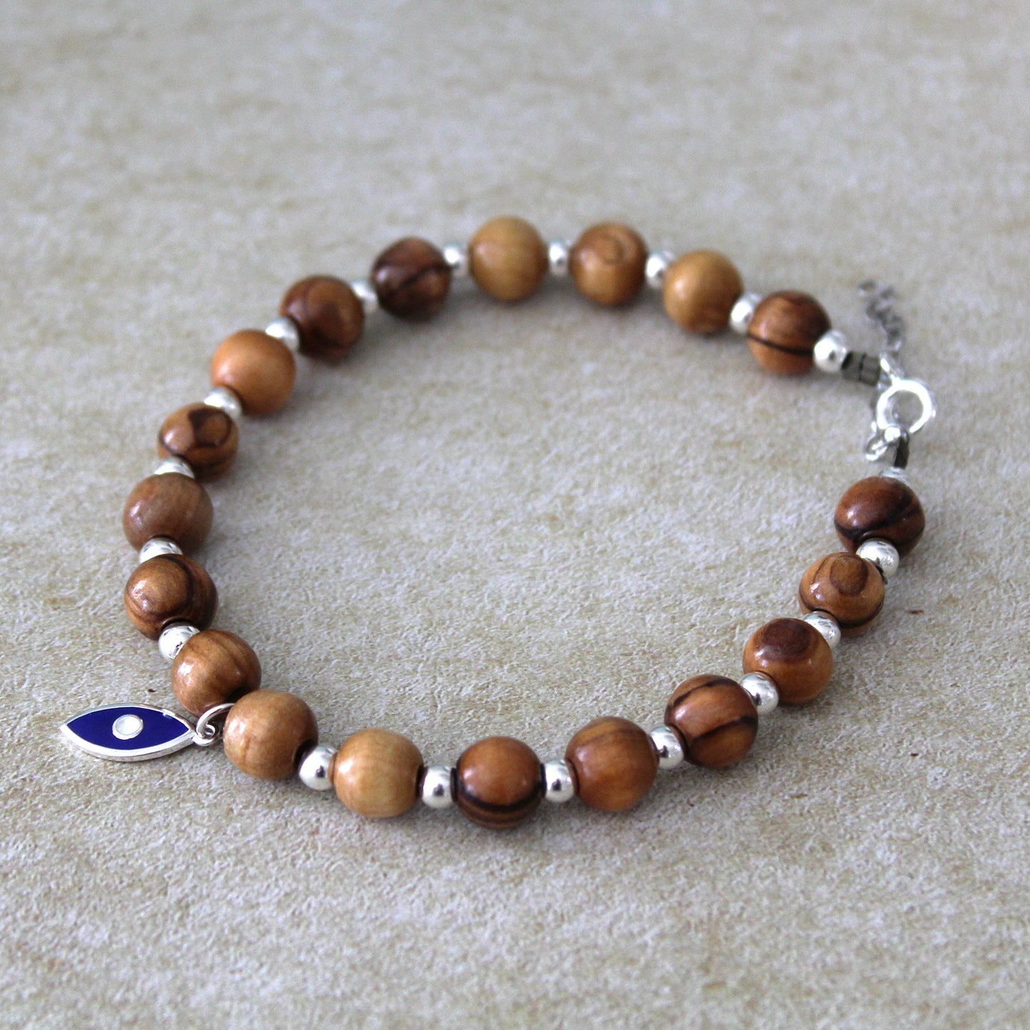 Divine Guardian: Handcrafted Lava Stone Bracelet with Enchanting Silver 925 Blue Fish Charm - A Fusion of Israeli and Christian Jewelry