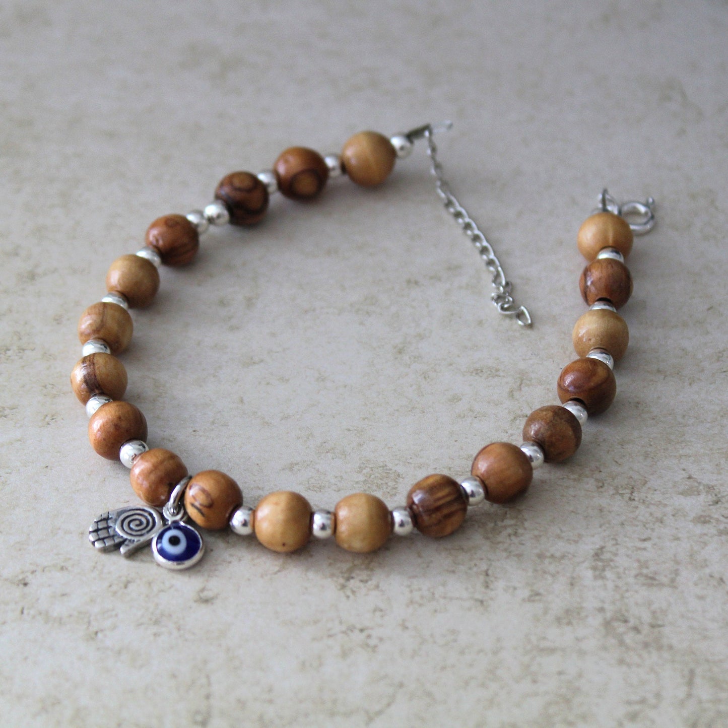 Sacred Sentinel: Artisan Evil Eye and Hamsa Hand Bracelet, a Symbolic Shield of Protection and Trendy Talisman Against Negativity