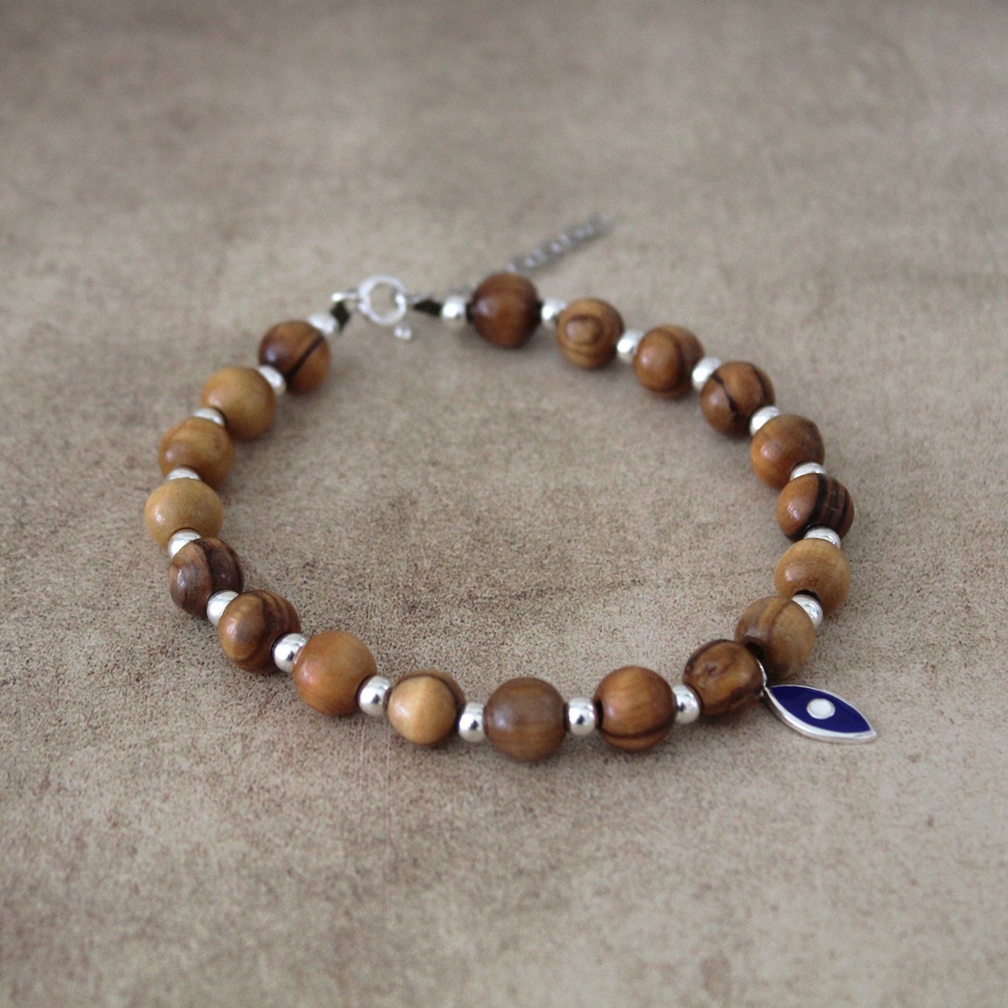 Divine Guardian: Handcrafted Lava Stone Bracelet with Enchanting Silver 925 Blue Fish Charm - A Fusion of Israeli and Christian Jewelry