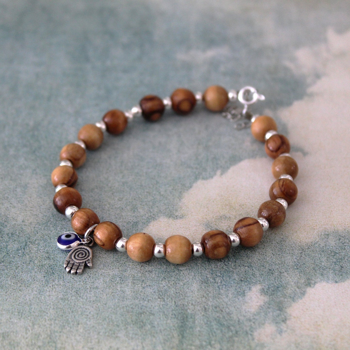 Sacred Sentinel: Artisan Evil Eye and Hamsa Hand Bracelet, a Symbolic Shield of Protection and Trendy Talisman Against Negativity